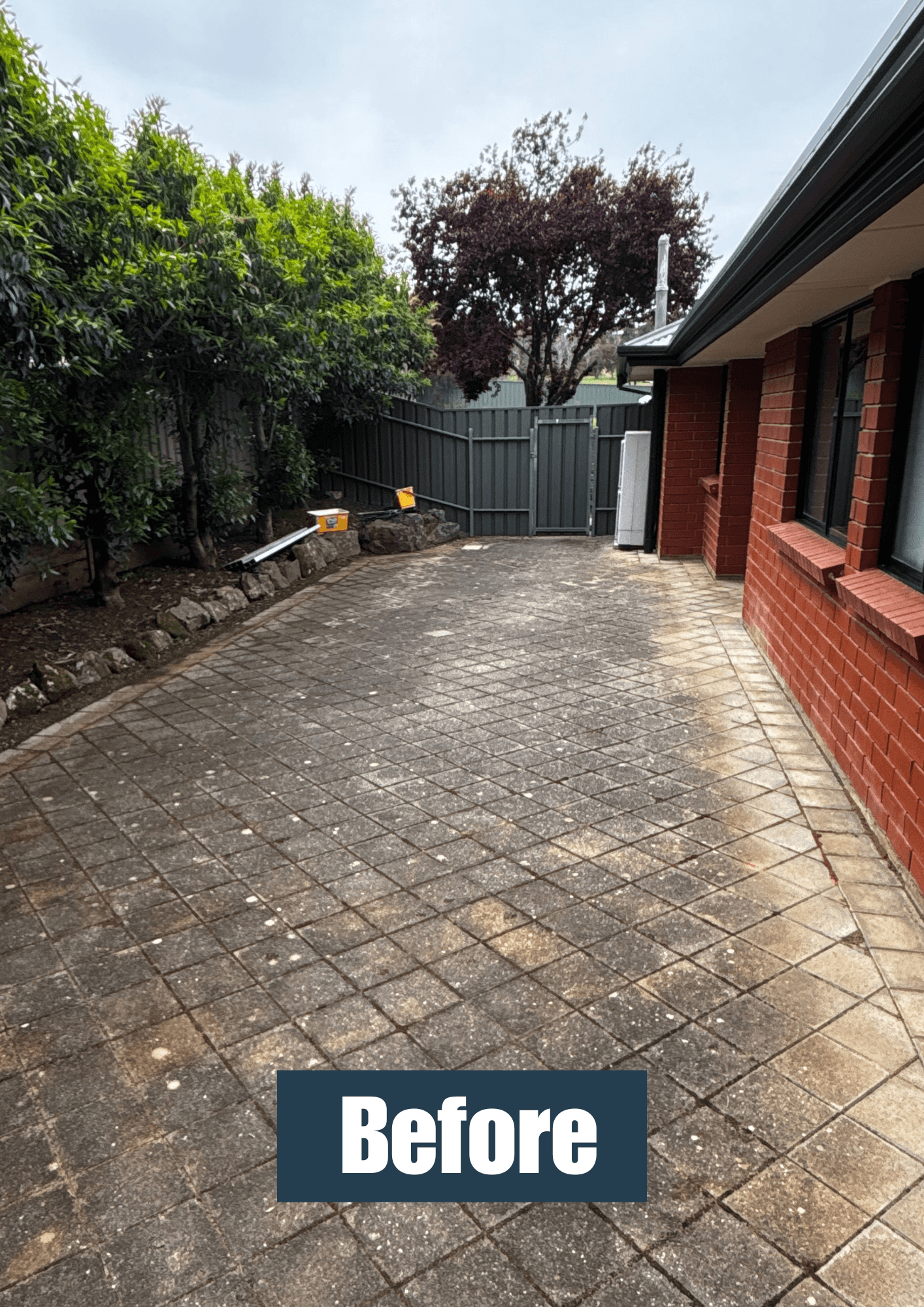 Pressure washing paved area before result 3