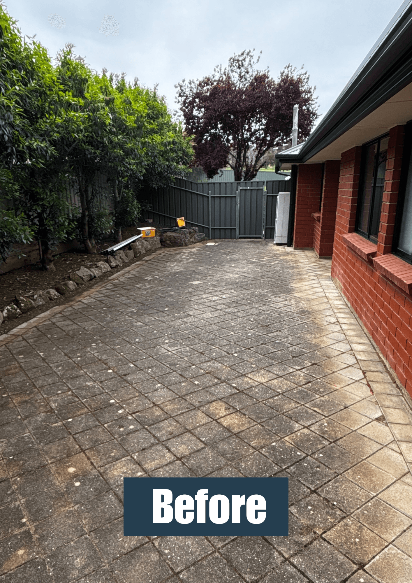 Pressure washing paved area before result 3